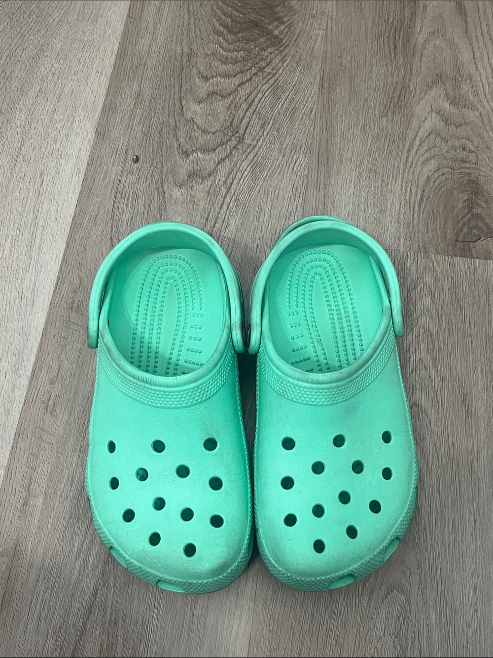 Crocs Classic Clogs in a mint green color size 7 Women's